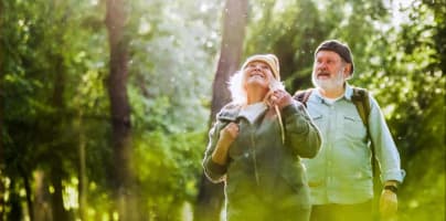 Older couple walking together in a sunlit forest, looking upward and smiling, with the headline “Study Reveals Why Some Seniors Recover After a Health Crisis—While Others Don’t and source label “Epoch Health.